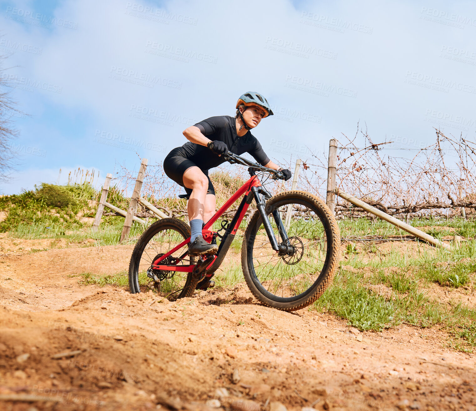 Buy stock photo Bicycle fitness, countryside road and woman on a bike with speed for sports race on cycling path. Adventure, biker exercise and fast athlete doing training in nature on a trail for cardio and workout