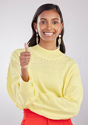 Buy stock photo Portrait, thumbs up and fashion with a woman in on a gray background studio to promote contemporary clothes. Thank you emoji, motivation and style with an attractive female indoor to model clothing
