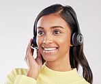 Woman has smile on face, callcenter and headset with mic, CRM and contact us with consultant on studio background. Happy, Indian female with customer service agent and help desk with tech support