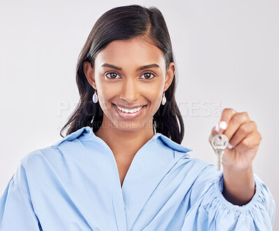 Buy stock photo Happy, homeowner and a portrait of a woman with keys isolated on a white background in a studio. Giving, smile and a girl holding a key to a house, apartment or property for real estate on a backdrop