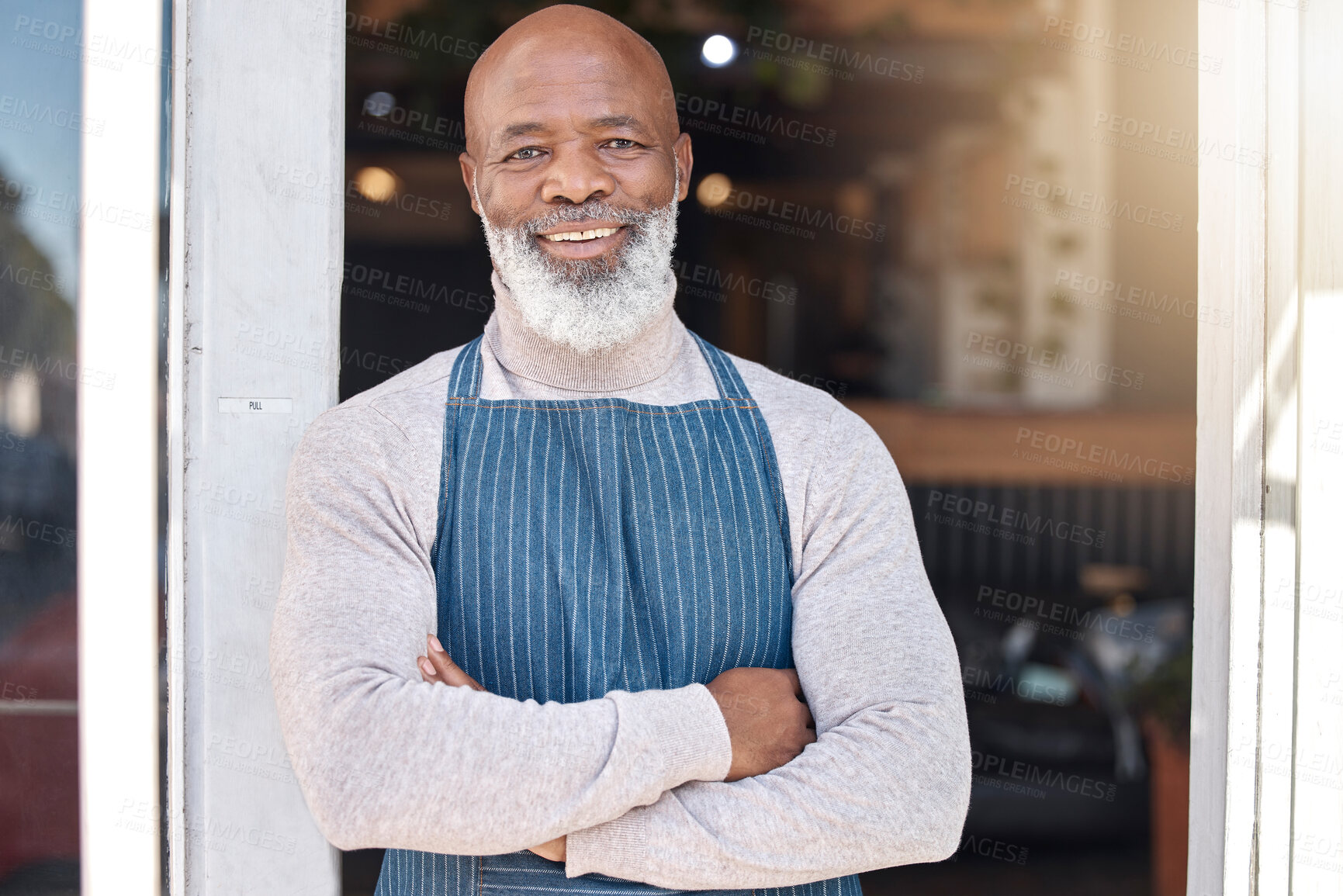 Buy stock photo Black man, portrait smile and arms crossed in small business cafe or retail store by entrance door. Happy African American senior businessman standing in confidence at restaurant or coffee shop