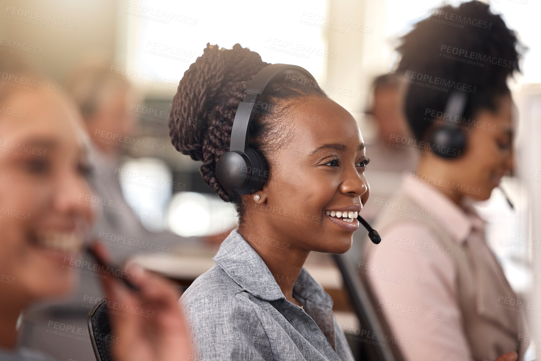 Buy stock photo Call center, black woman and smile on face for sales, telemarketing and support. Professional female consultant or agent with a headset, mic and team for customer service, crm or help desk for advice