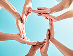 Hands circle, synergy and below with sky, group and family with support, motivation or love. People, men and women with hand together for solidarity, bonding or outdoor with vacation, summer and help