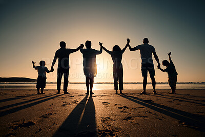 family holding hands silhouette