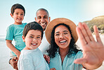 Family, parents and children selfie at beach or outdoor with a smile, happiness and care together. Happy boy kids, man and woman laughing portrait on holiday, adventure or vacation to travel or relax