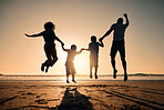 Beach silhouette, sunset and a family jumping for freedom, summer energy or travel. Happy, nature and back of a mother, father and children holding hands for a jump at the ocean in the evening