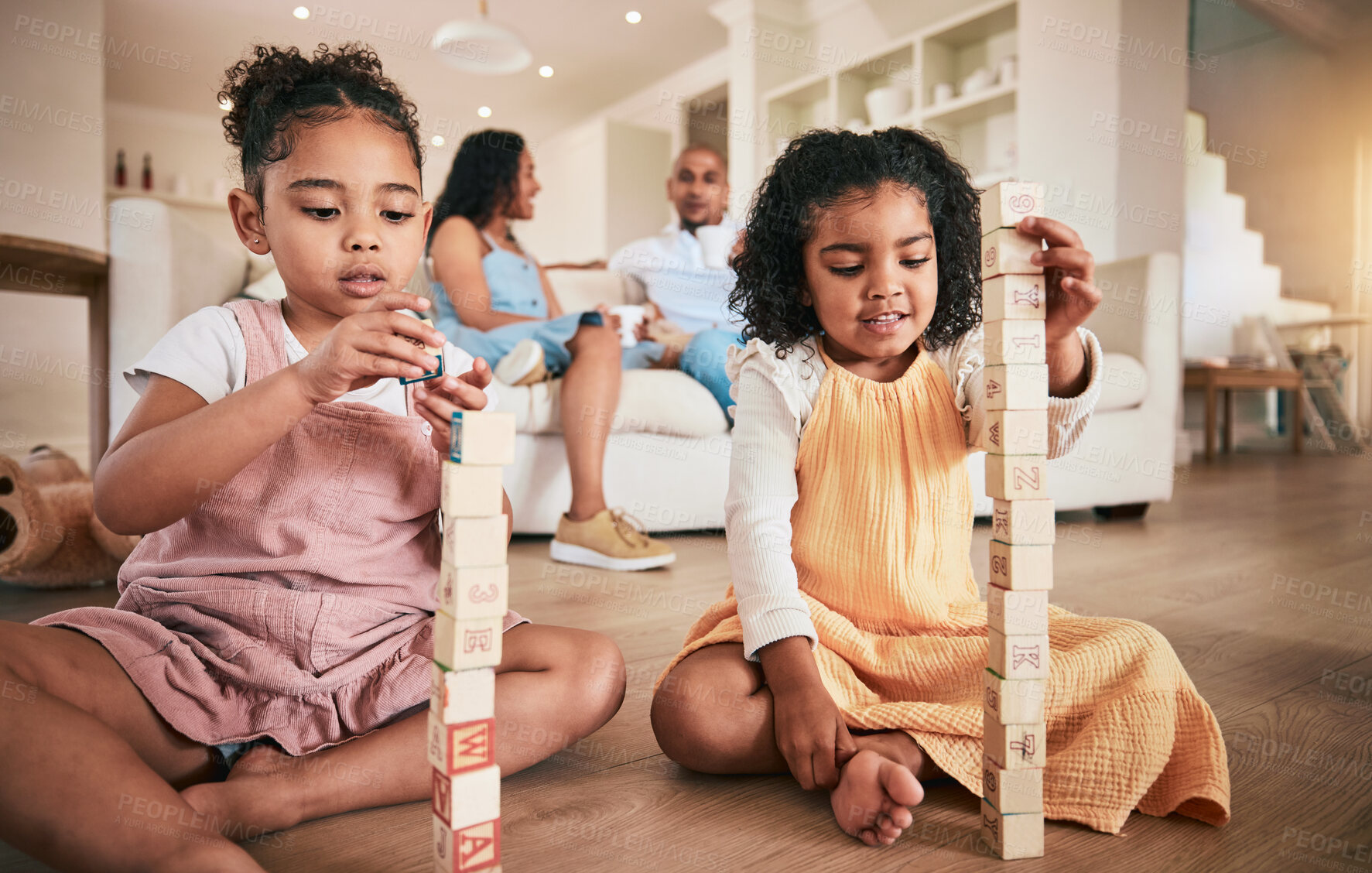 Buy stock photo Toys, building blocks and children on a living room floor for bonding, learning and having fun with parents. Family, education and block activity by kids with creative cubes for development at home 