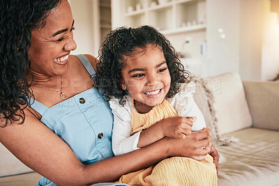 Buy stock photo Happy, hug and laughing with mother and daughter on sofa for bonding, affectionate and love. Support, cuddle and smile with woman and young girl in living room at home for relax, care and embrace