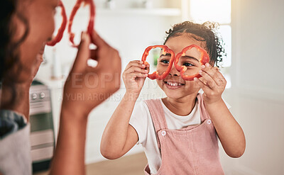 Buy stock photo Food, cooking and mother and girl play together for learning, child development and bonding in kitchen. Family home, vegetables and mom and child having fun in meal prep for lunch, dinner and supper