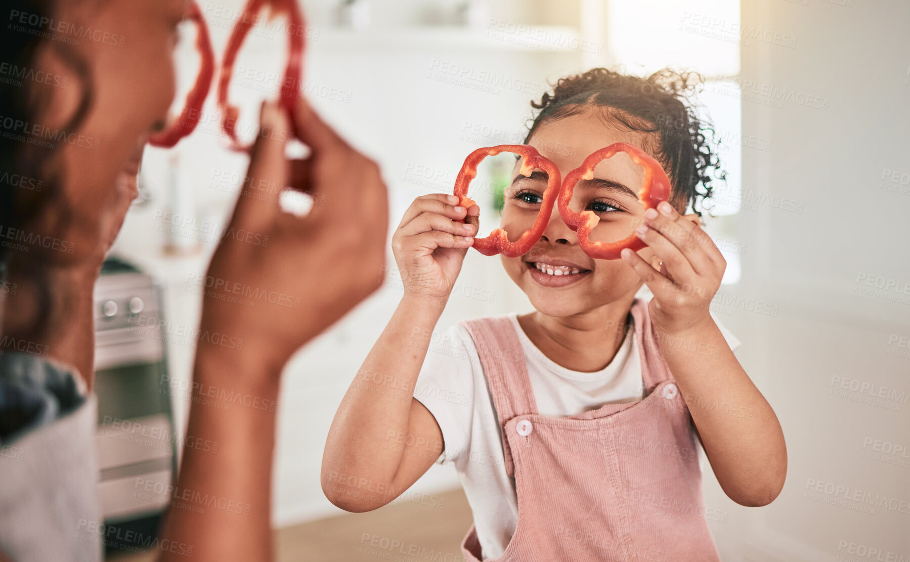 Buy stock photo Food, cooking and mother and girl play together for learning, child development and bonding in kitchen. Family home, vegetables and mom and child having fun in meal prep for lunch, dinner and supper