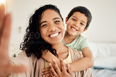 Buy stock photo Smile, selfie and mother with child on a bed hug, love and bonding in their home together. Portrait, embrace or woman with son in bedroom waking up, happy and posing for profile picture, photo or pov