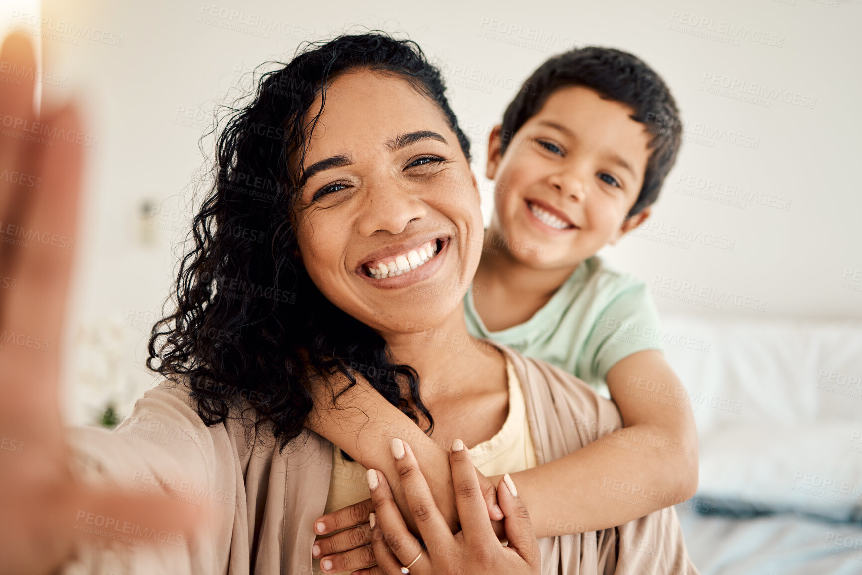 Buy stock photo Smile, selfie and mother with child on a bed hug, love and bonding in their home together. Portrait, embrace or woman with son in bedroom waking up, happy and posing for profile picture, photo or pov