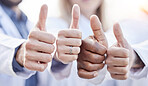 Hands, doctors and thumbs up together in closeup for motivation, agreement and team building in hospital. Doctor, teamwork and hand gesture for solidarity, support and goals for healthcare in clinic