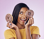 Donut, dessert and chocolate with woman in studio for diet, snack and happiness. Sugar, food and smile with female hiding and isolated on pink background for nutrition, playful and craving mockup