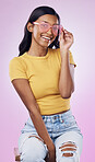 Sunglasses, fashion and portrait of happy Indian woman on pink background with smile, confidence and beauty. Happiness, summer aesthetic and girl in studio with cosmetics, accessories and style