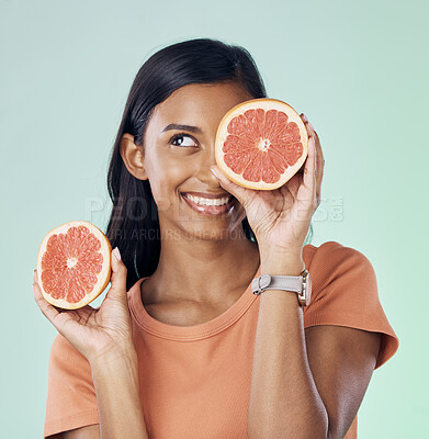 Buy stock photo Studio beauty, face and happy woman with grapefruit for natural skincare, health and wellness routine. Fruit detox, vitamin c benefits and nutritionist person with citrus product on green background