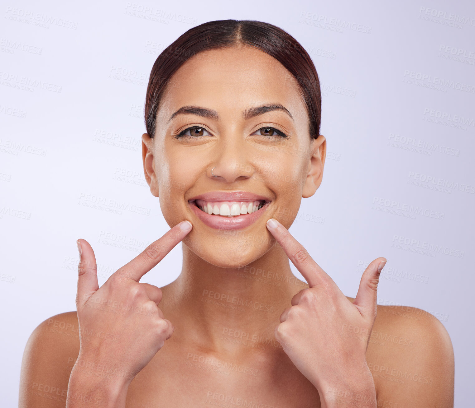 Buy stock photo Portrait or happy woman pointing to teeth, lipstick or dental hygiene with a smile on white background. Face, teeth whitening results or girl beauty model smiling after dentist mouth cleaning checkup