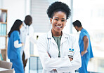 Black woman, doctor leader and arms crossed in portrait at  clinic for goals, excited and career vision. Female medic, leadership and management with confidence, success and happy for job at hospital