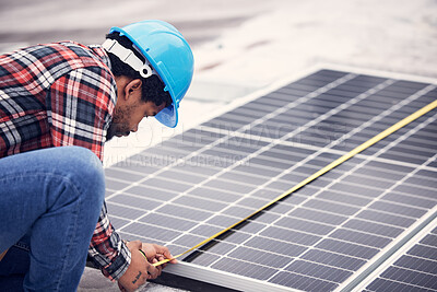 Buy stock photo Technician, measuring tape and solar panel on rooftop for check, planning or renewable energy project. Black man, photovoltaic system and roof installation with focus, sustainable building or service