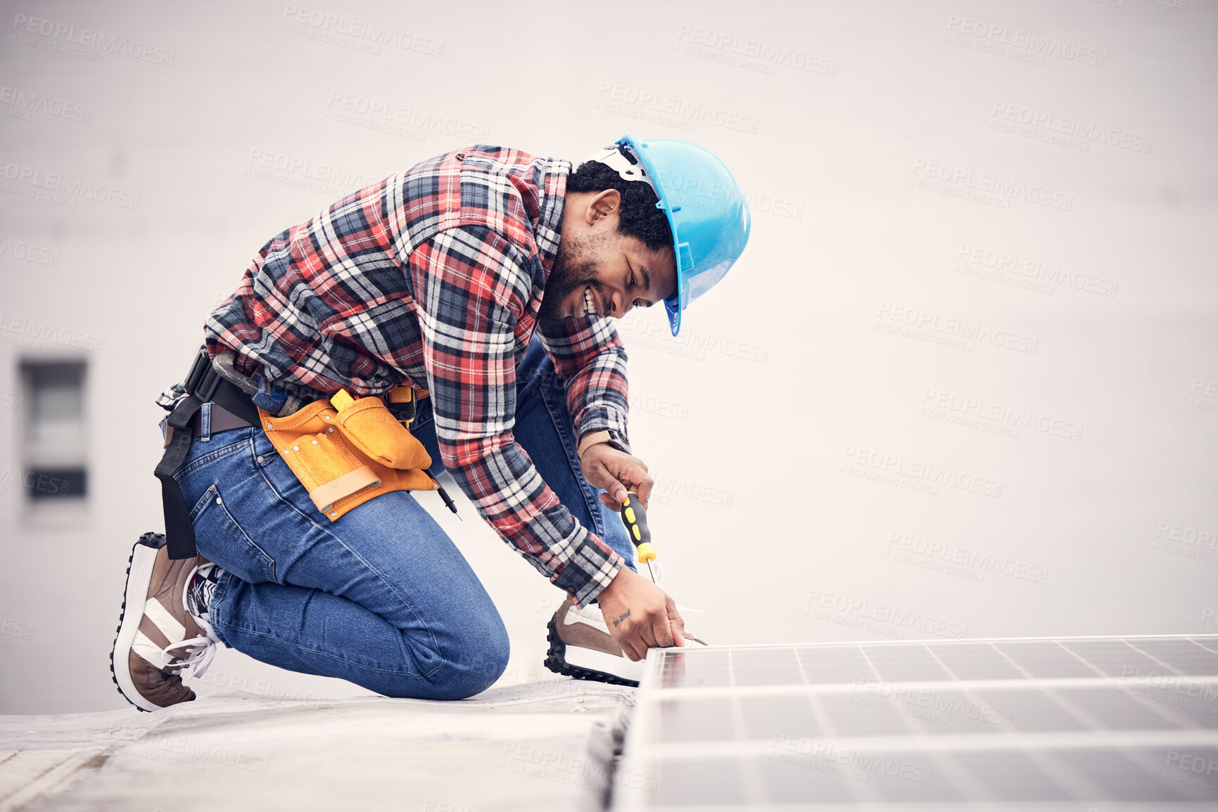 Buy stock photo Solar panel installation, engineer and black man on roof, sustainable or renewable energy mockup. Technician, photovoltaic electricity and happy person in maintenance or inspection with screwdriver.