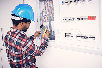 Buy stock photo Electrician multimeter, electric switch box and man test cable system, wiring or measure voltage power supply. Quality control inspection, African repair person and technician electricity maintenance