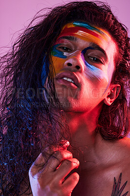 Buy stock photo Creative, face paint and art with portrait of man in studio for beauty, self love and designer. Fantasy, neon and light with male model on pink background for makeup, colours and cosmetics