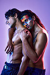 Gay, men and art model for beauty creativity with paint as artwork isolated in a purple studio background. Colorful, embracing and creative people for artistic beauty or fashion in a backdrop
