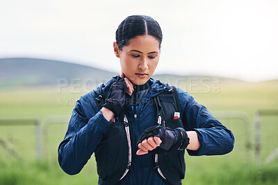 Buy stock photo Heart rate, time and woman in the countryside ready for fitness and exercise checking pulse. Sports, training and smart watch of a female athlete looking at workout app for health and wellness