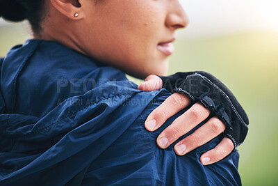 Buy stock photo Hand closeup, shoulder pain and woman outdoor with glove for cycling, sport and fitness with emergency. Girl, nature and muscle injury at training, workout or exercise in nature with body fatigue