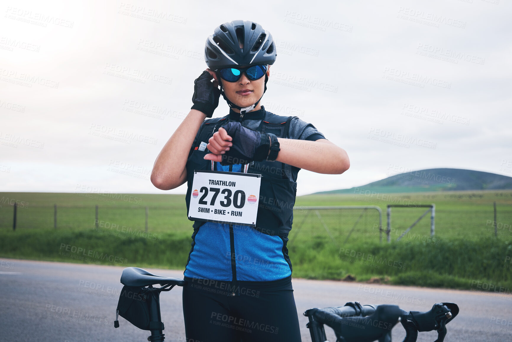 Buy stock photo Woman outdoor, bicycle and watch to heart rate, time or speed for race, challenge or adventure. Girl, bike and check for health, fitness or gps on countryside road for cycling, contest or sport event