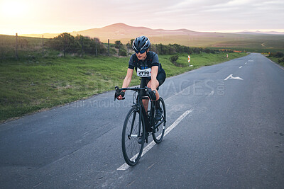 Buy stock photo Fitness, cycling and woman athlete on a mountain while training for a race, competition or marathon. Sports, cycle and female cyclist doing a cardio exercise or workout with bicycle in road on a hill