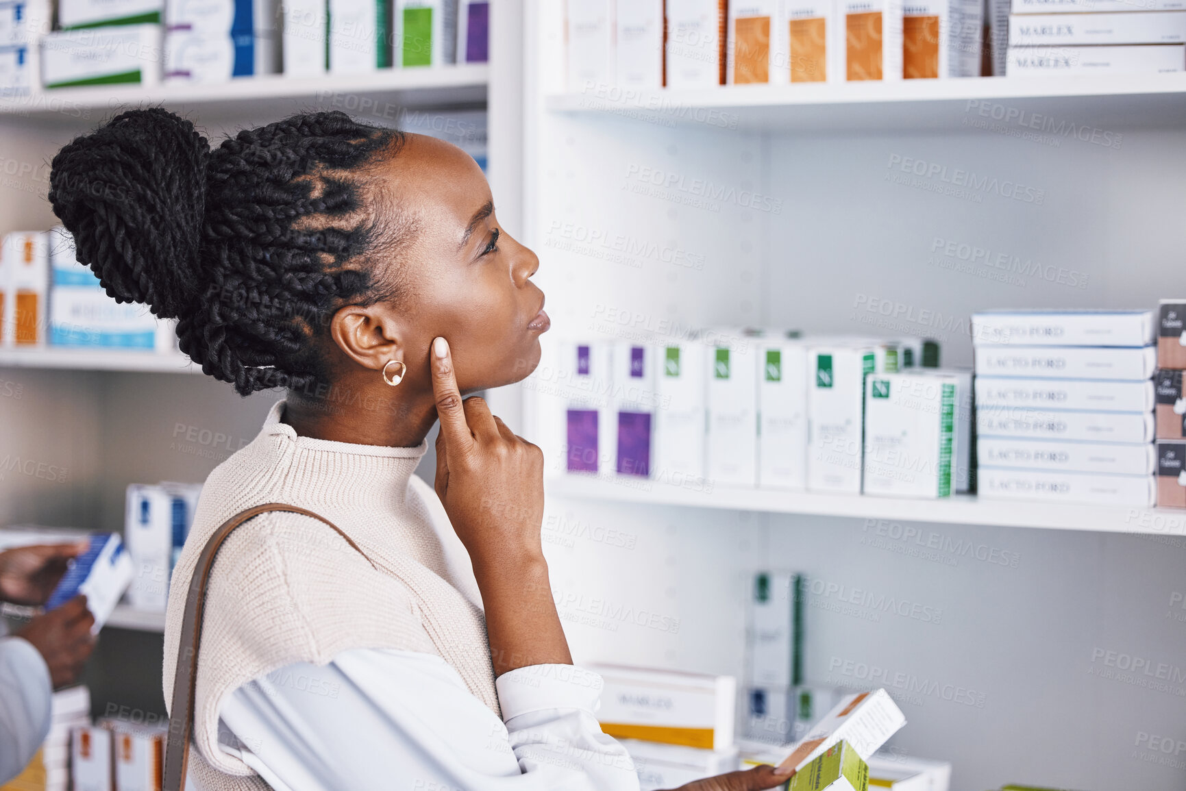 Buy stock photo Black woman, patient and thinking for healthcare drugs, medication decision for pain relief on pharmacy shelf. Thoughtful African female customer looking at pharmaceutical products for self diagnosis