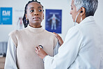 Doctor, black woman and stethoscope on chest, breathe and test for lung health care and advice at clinic. Patient consulting medical professional, health care check and faq, info and help at hospital