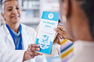 Buy stock photo Consulting pharmacist, prescription drugs in package and advice on health care, medicine and insurance. Healthcare, pharmacy and woman consultant at clinic with medical information with pills in bag.