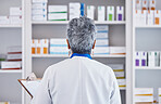 Back, pharmacy and checklist with woman in store for inventory, medicine and shelf stock. Retail, shopping and healthcare with pharmacist and clipboard for medical, prescription and product