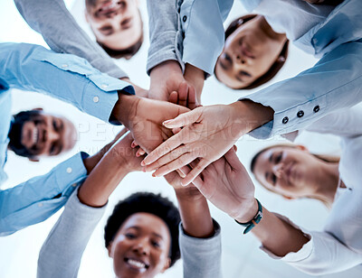 Buy stock photo Business people, hands stack and teamwork in low angle, team building and trust. Solidarity, huddle and happy group or staff of men and women with hand together for motivation, synergy and support.