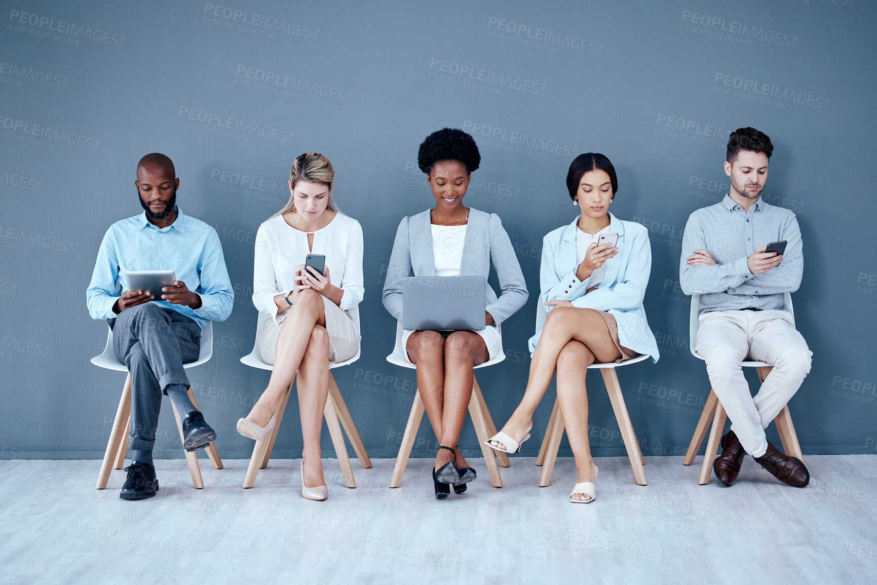 Buy stock photo Business people, networking and technology in waiting room for interview, meeting or job search at office. Diversity group of employees sitting in row for recruitment process, collaboration or hiring