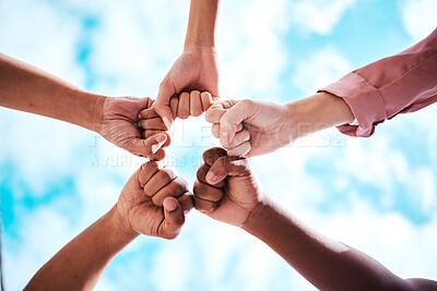 Buy stock photo People, hands and fist bump in collaboration, trust or unity for partnership, community or diversity with sky below. Diverse group touching hands for teamwork, success or motivation in solidarity