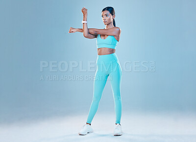 Buy stock photo Fitness, warm up and mockup with a sports woman in studio on a gray background for health or wellness. Exercise, arms stretch and space with a young female athlete training for a healthy body