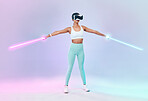 Game, virtual reality glasses and woman with lightsaber, future and fun against studio background. Female player, gamer or girl with vr eyewear, fantasy game or weapon with confidence and laser saber