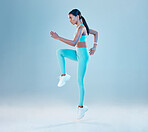 Fitness, focus and mockup with a woman runner in studio on gray background for health or wellness. Exercise, mindset and space with a young female athlete running or training for cardio or endurance