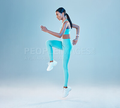 Buy stock photo Fitness, focus and mockup with a woman runner in studio on gray background for health or wellness. Exercise, mindset and space with a young female athlete running or training for cardio or endurance