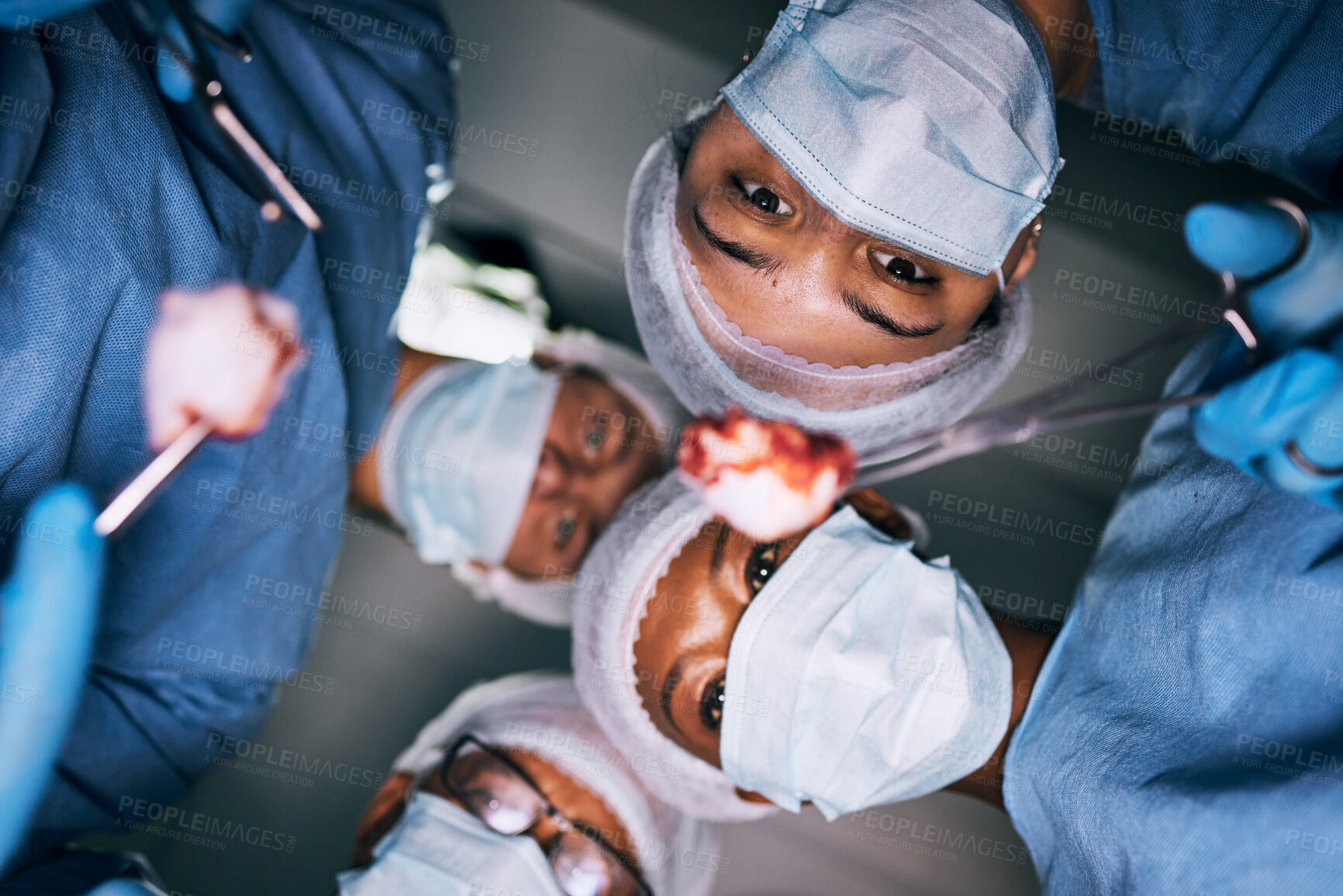 Buy stock photo Medical, surgery and pov of doctors in operating room for emergency, healthcare and teamwork. Insurance, medicine and treatment with group of people for injury, surgeon and operation from bottom