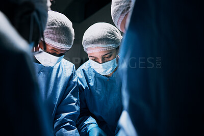 Buy stock photo Hospital, surgery and team of doctors in theatre for medical support, teamwork or healthcare solution in group. Focus of nurses and surgeon, face mask and working in operating room, emergency or help