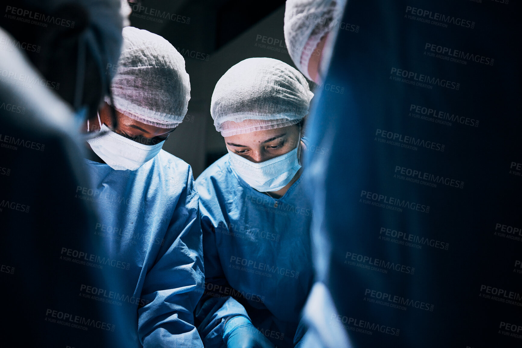 Buy stock photo Hospital, surgery and team of doctors in theatre for medical support, teamwork or healthcare solution in group. Focus of nurses and surgeon, face mask and working in operating room, emergency or help