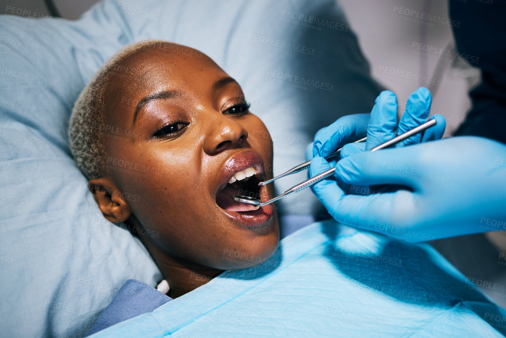 Buy stock photo Healthcare, teeth and black woman with dental procedure, surgery and wellness in a hospital bed. Female person, lady and patient with medical equipment, recovery and check up with tooth whitening
