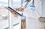 Doctor, woman with tablet in hands and digital medical results with hospital schedule and healthcare info online. Female physician, health insurance and professional in medicine with technology