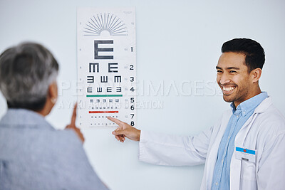 Eye exam, doctor and patient with vision and healthcare, reading chart to check eyesight with health insurance. Happy man optometrist, woman and medical consultation with ophthalmology at clinic