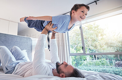 Buy stock photo Happy, airplane play and dad with child and happiness in a bedroom with trust and love. Happiness, father and young kid together in the air from flying game feeling excited with papa lift at home