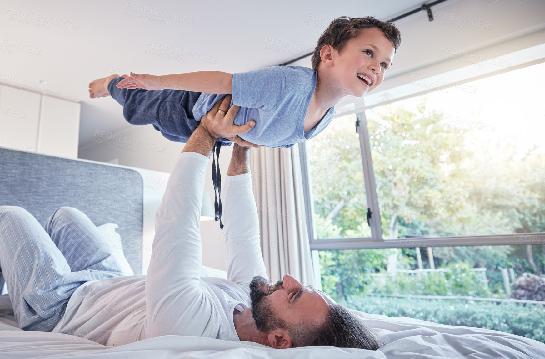 Buy stock photo Happy, airplane play and dad with child and happiness in a bedroom with trust and love. Happiness, father and young kid together in the air from flying game feeling excited with papa lift at home